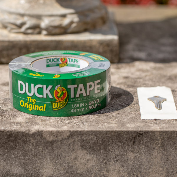 Hide a spare key outside with duct tape