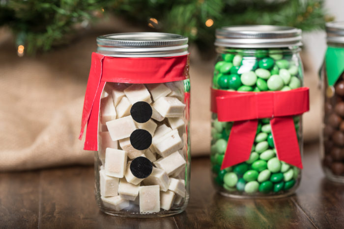 A Snowman decoration made form Duck Tape and a mason jar.