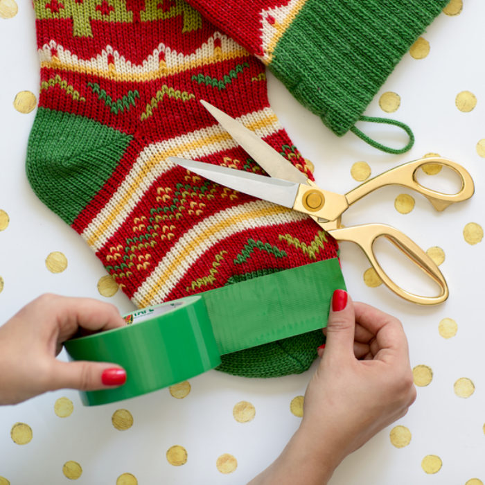 Repairing sock holes and tears with colorful Duck Tape