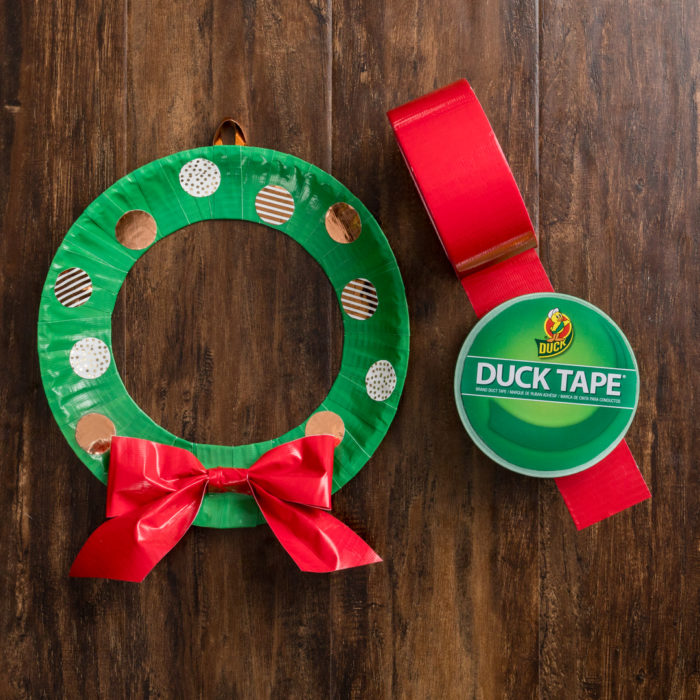 A wreath made out of green and red colored Duck Tape