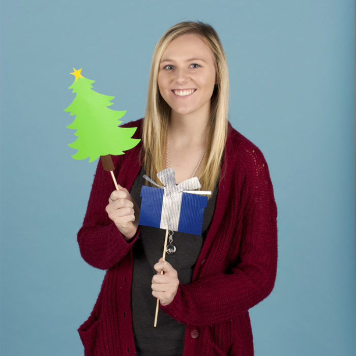 Woman posing with photo booth props made from Duck Tape