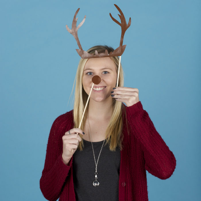 Woman posing with photo booth props made from Duck Tape