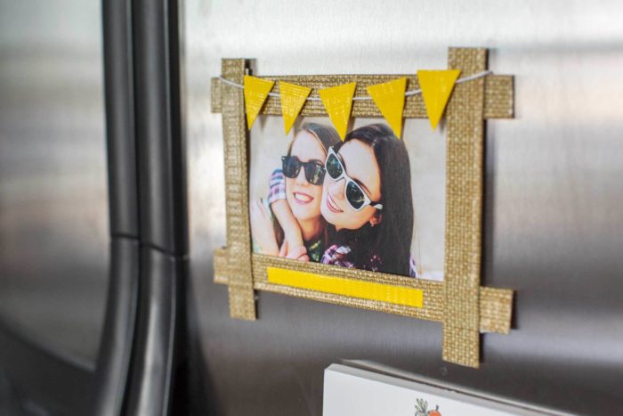 A washi tape frame on a refrigerator