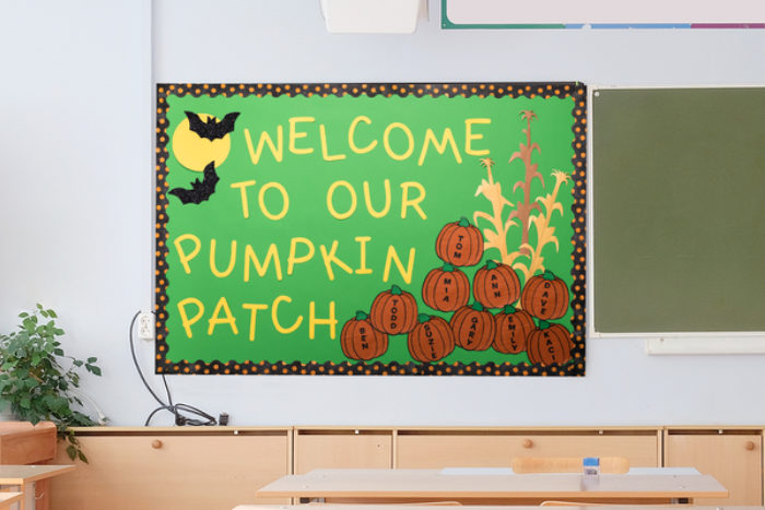 A bulletin board decorated with pumpkins