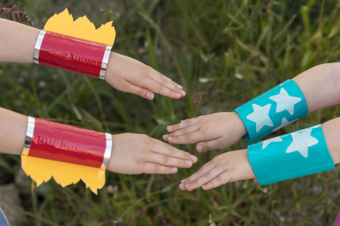 Two super hero wrist cuffs made out of Duck Tape.