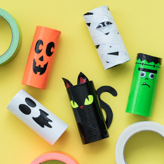 Several TP rolls decorated as different Halloween characters.