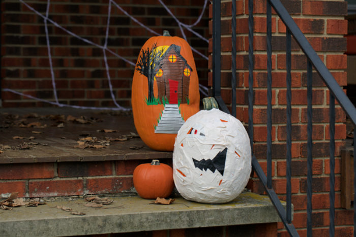 A pumpkin decorated as a mummy with white Duck Tape