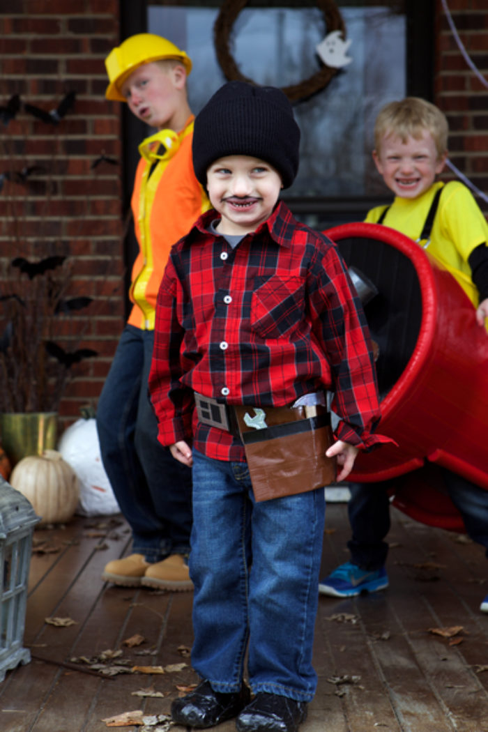 A child wearing a costume and tool belt made of Duck Tape