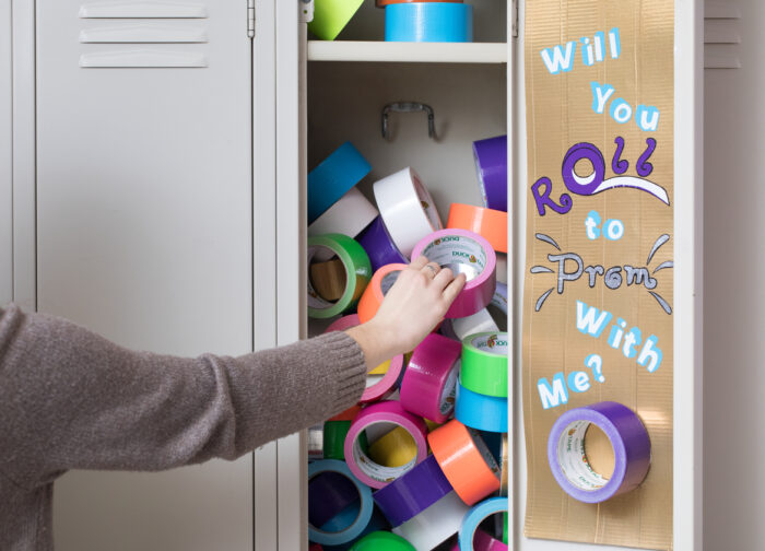 Promposal poster made out of duct tape that fits in a locker, asking someone to prom.