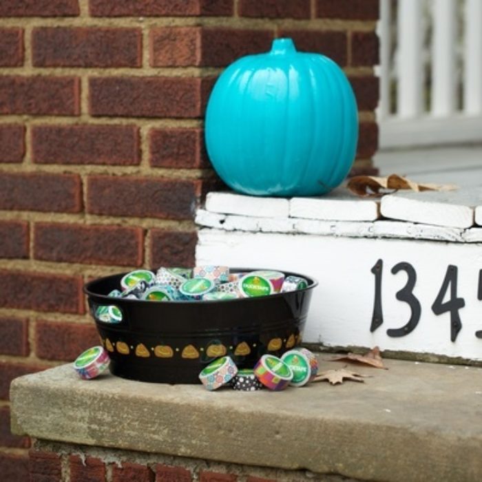 A pumpkin covered with teal Duck Tape.