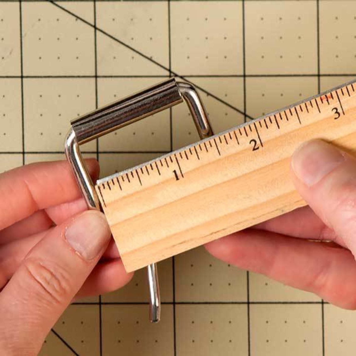 Buckle being measured to ensure that it is 1.5 inches wide