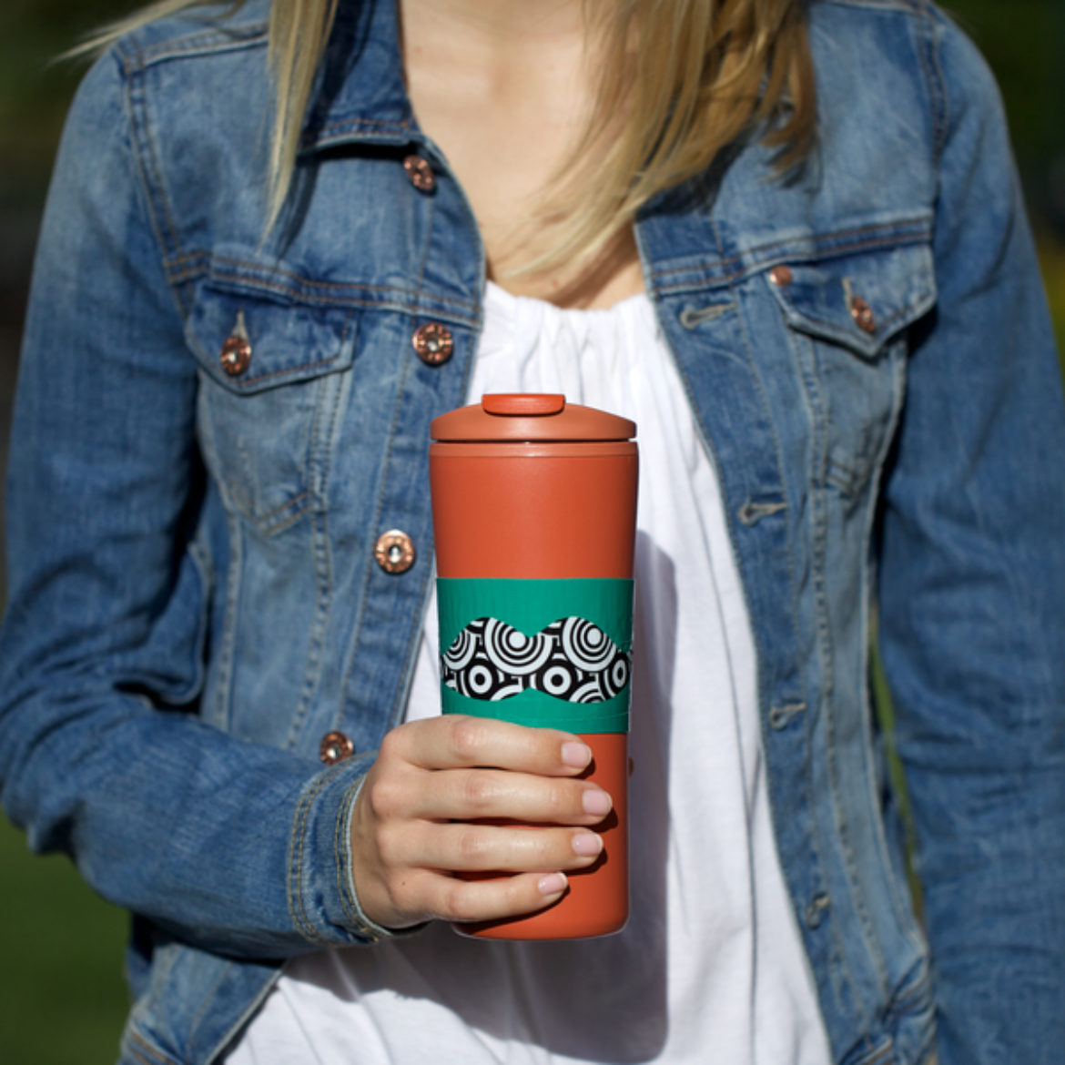 Woman holding a completed Duck Tape® Beverage Sleeve