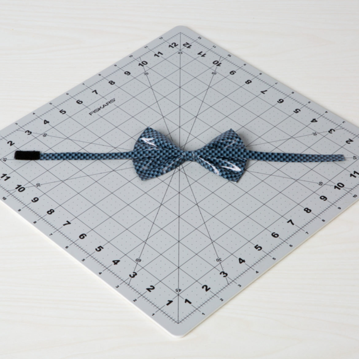 Completed bow tie, including hook and loop fastener on the ends of the strip