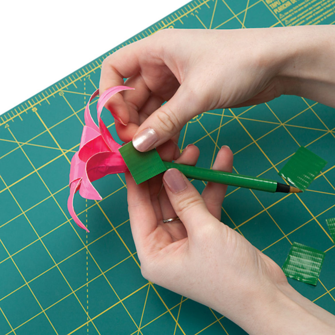 small strips of Duck Tape wrapped around the base of the flower where the petals are taped to the pen