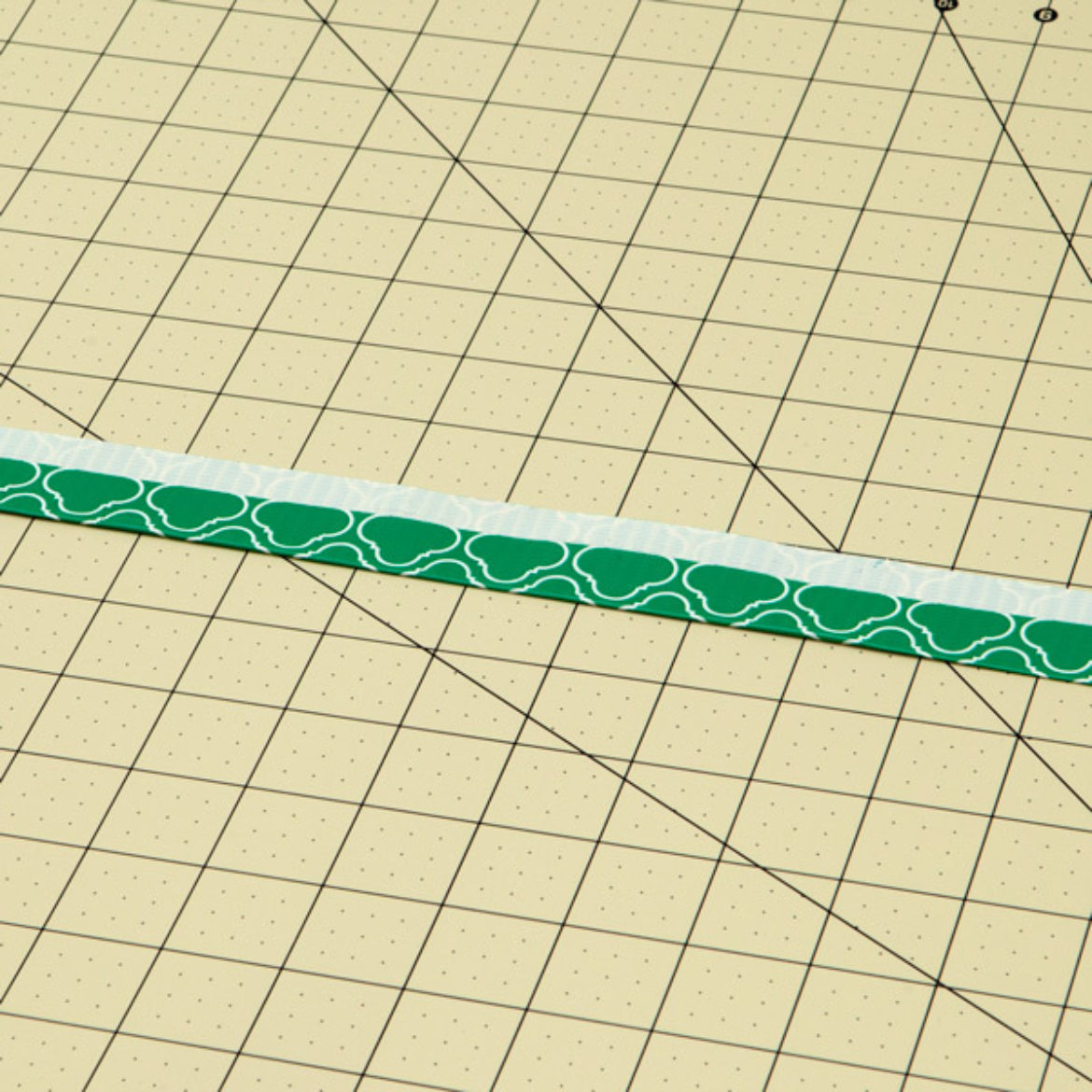 Strip from previous step folded lengthwise so that there is s thin strip of sticky side running along one side of the strip