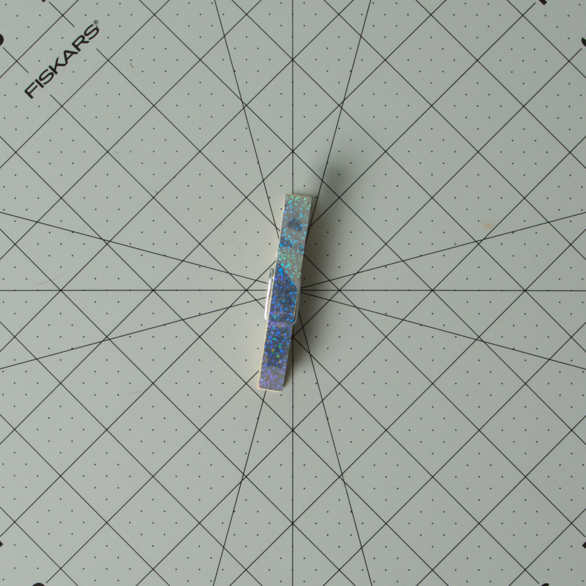 Prism tape from the previous step applied to the clothes pin
