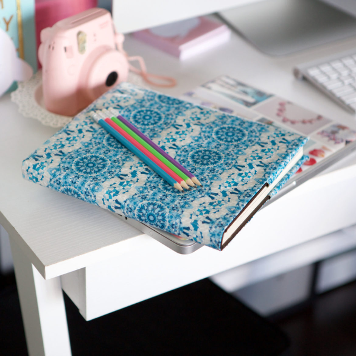 Completed Duck Tape® Textbook Cover placed on a desk