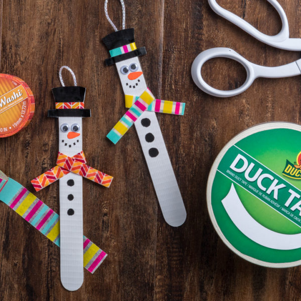 Snow men fashioned from popsicle sticks and Duck Tape