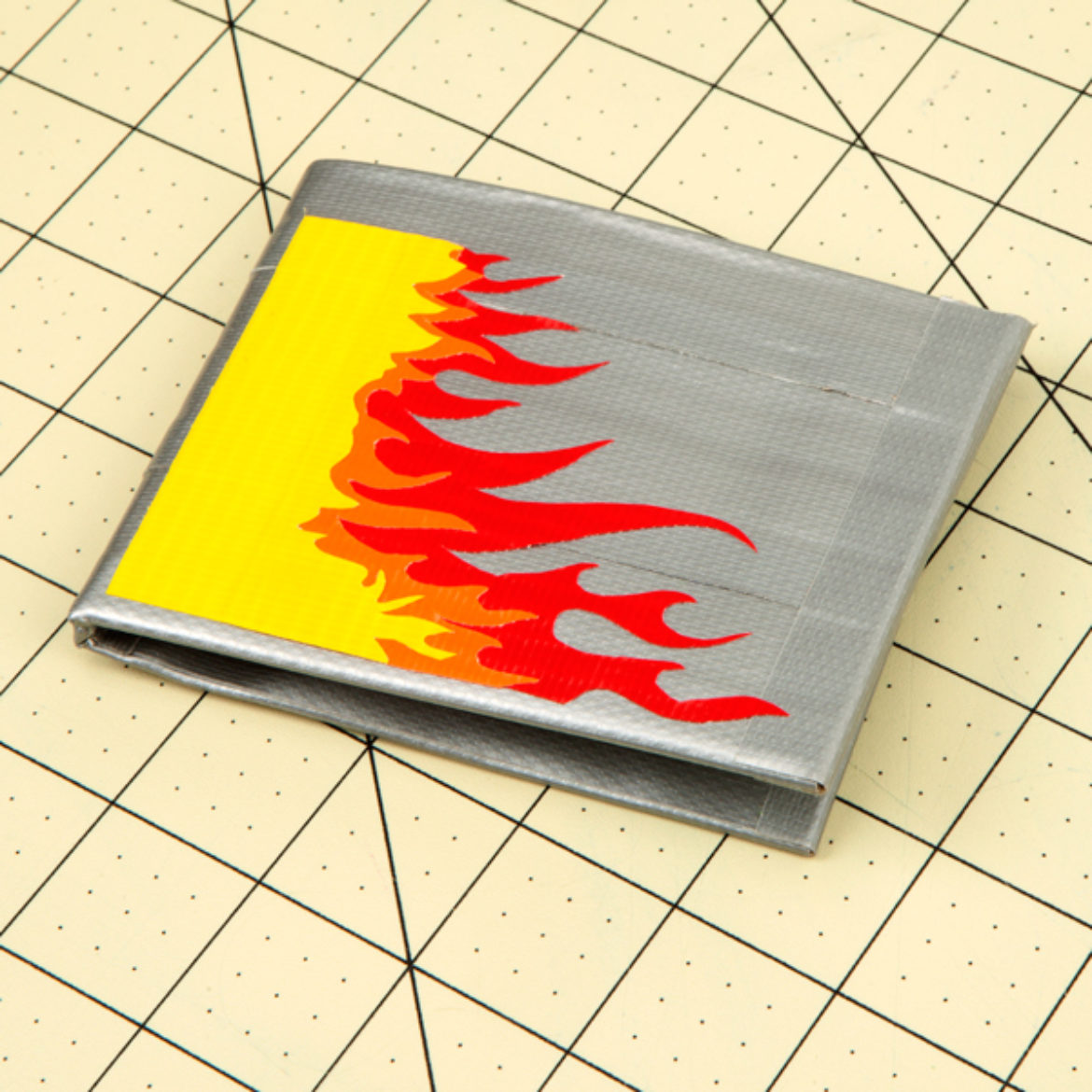 Wallet decorated with multicolored flame shaped pieces of tape
