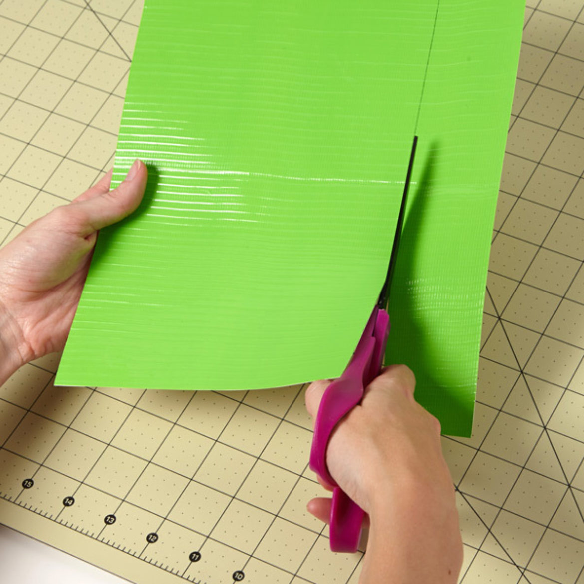 Duck Tape fabric being cut by scissors