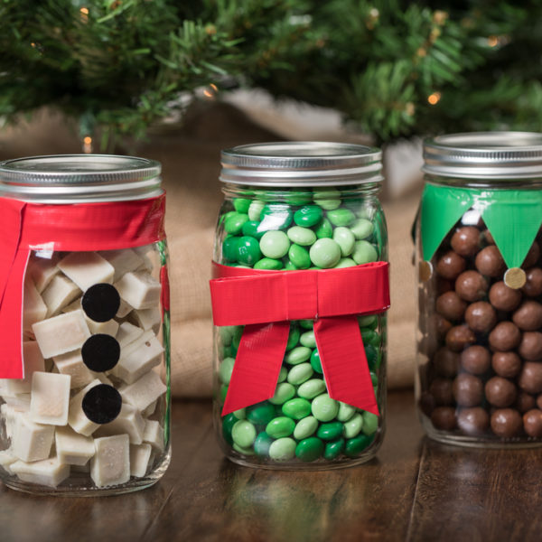 Jars full of candy decorated with Duck Tape