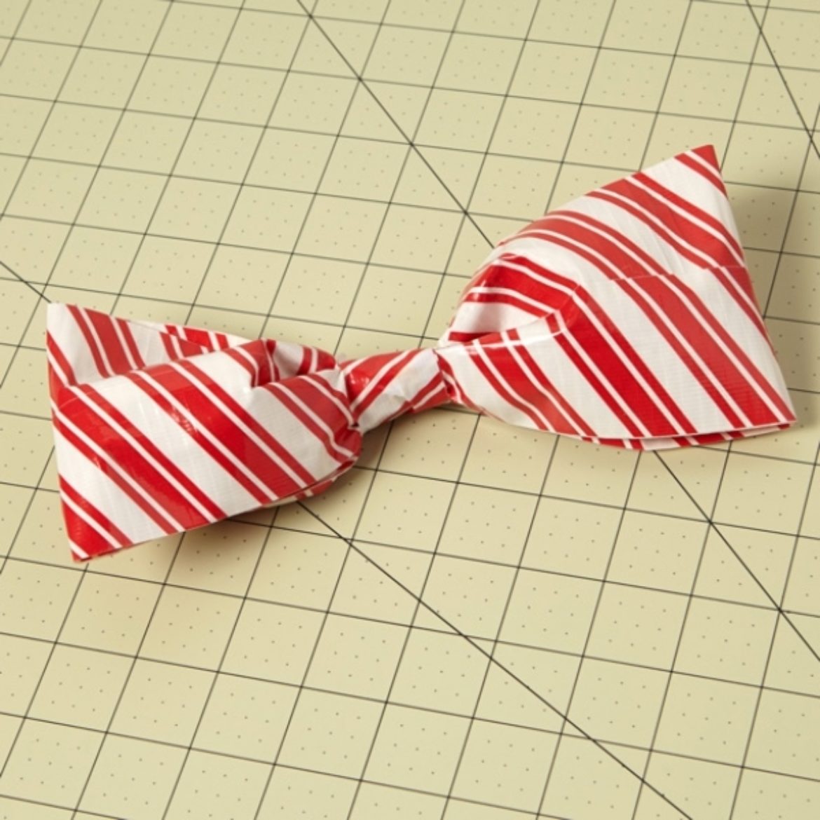 Bow fashioned from a loop of a doubled over strip of Duck Tape, secured tightly at the part where the two ends meet to create a bow tie shape