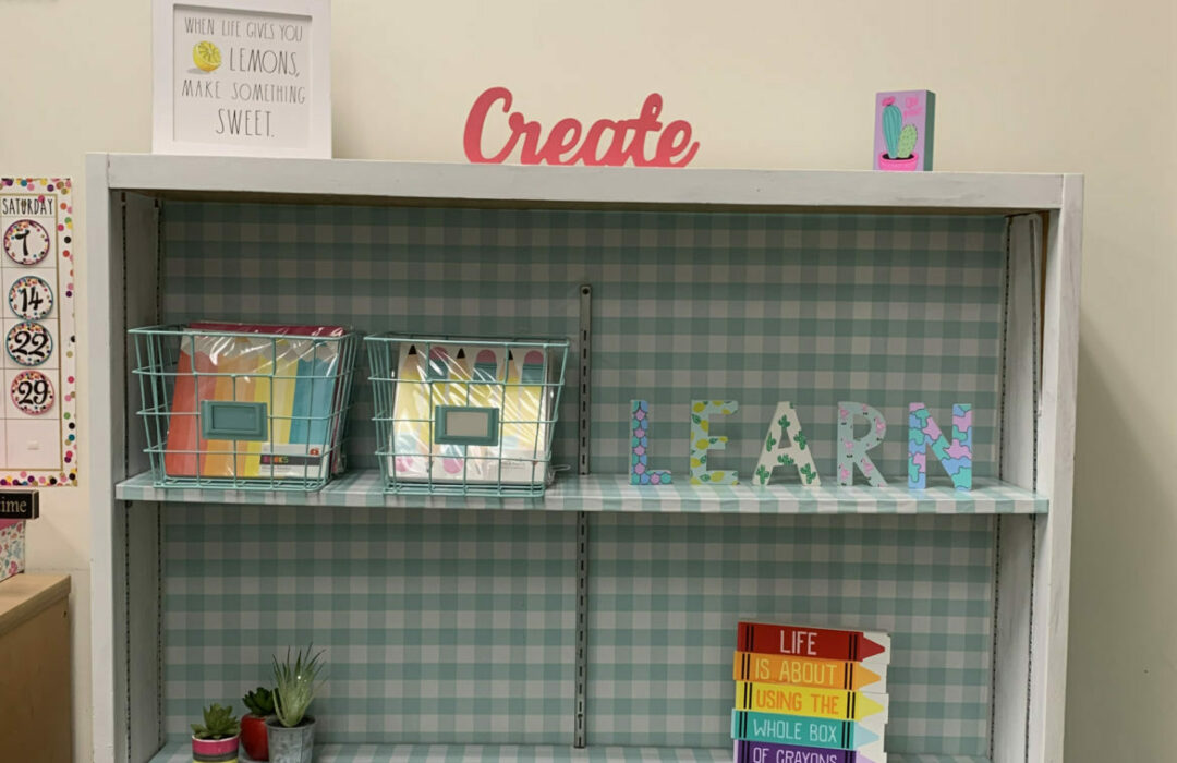 Bookshelf with blue shelves and colorful décor