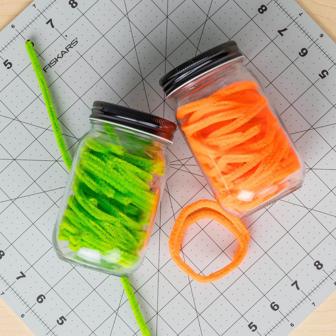 Jars filled with wound up pipe cleaners