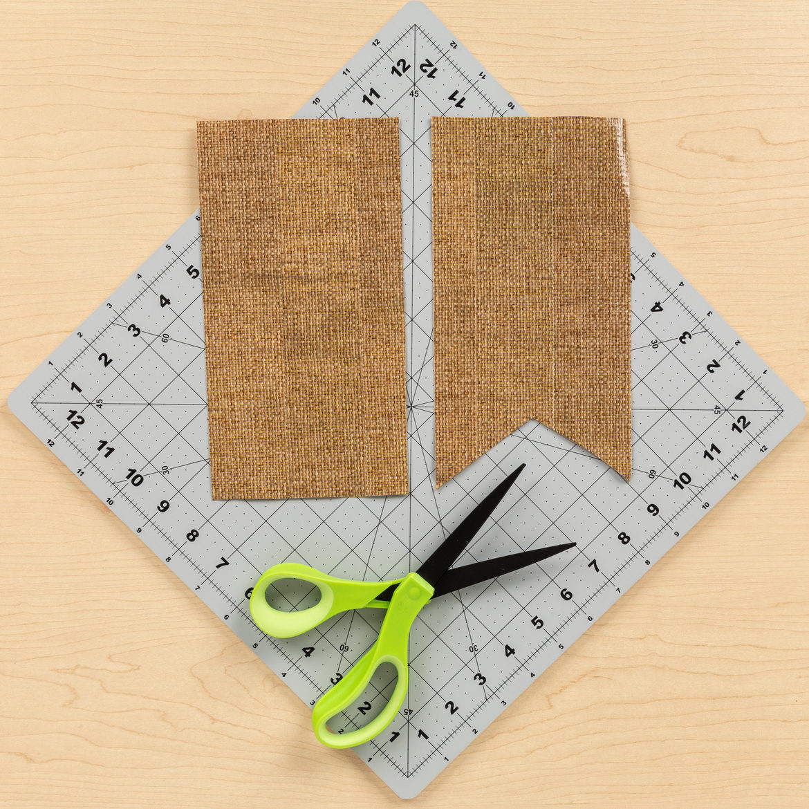 Burlap rectangles with a V shape cut out at the bottom to create a banner shape