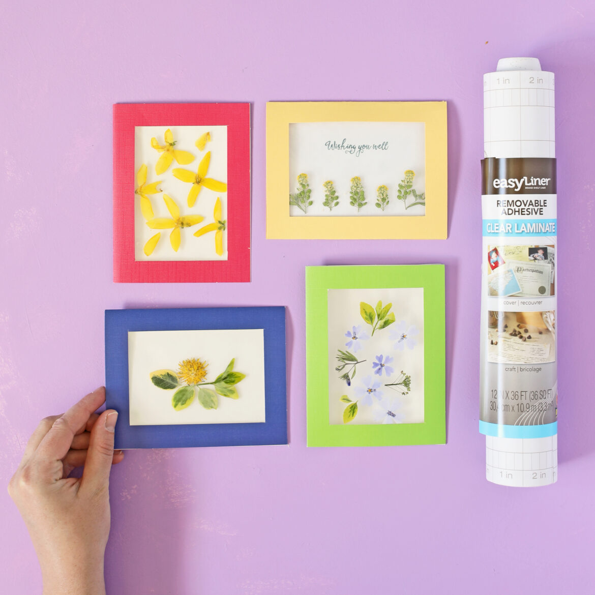 Pressed flower cards next to a roll of EasyLiner.