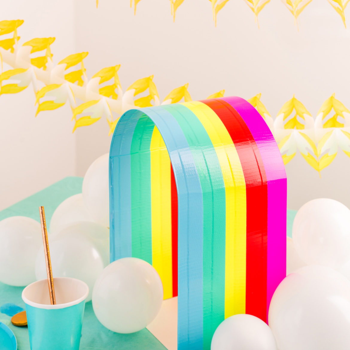 Completed Rainbow centerpiece surrounded by balloon clouds