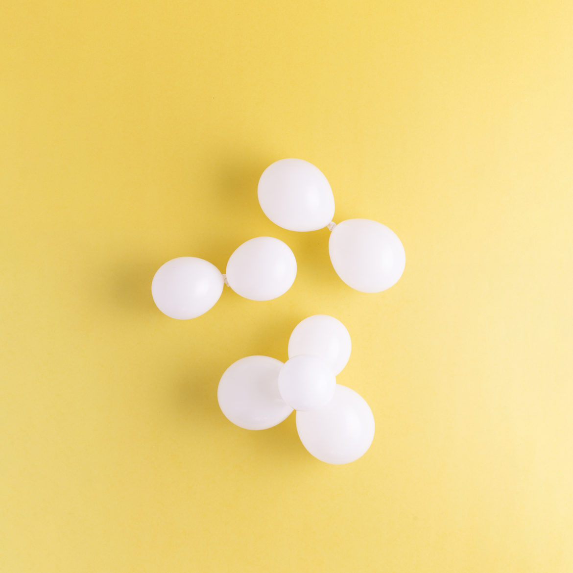 balloon clouds created by tying together small white balloons