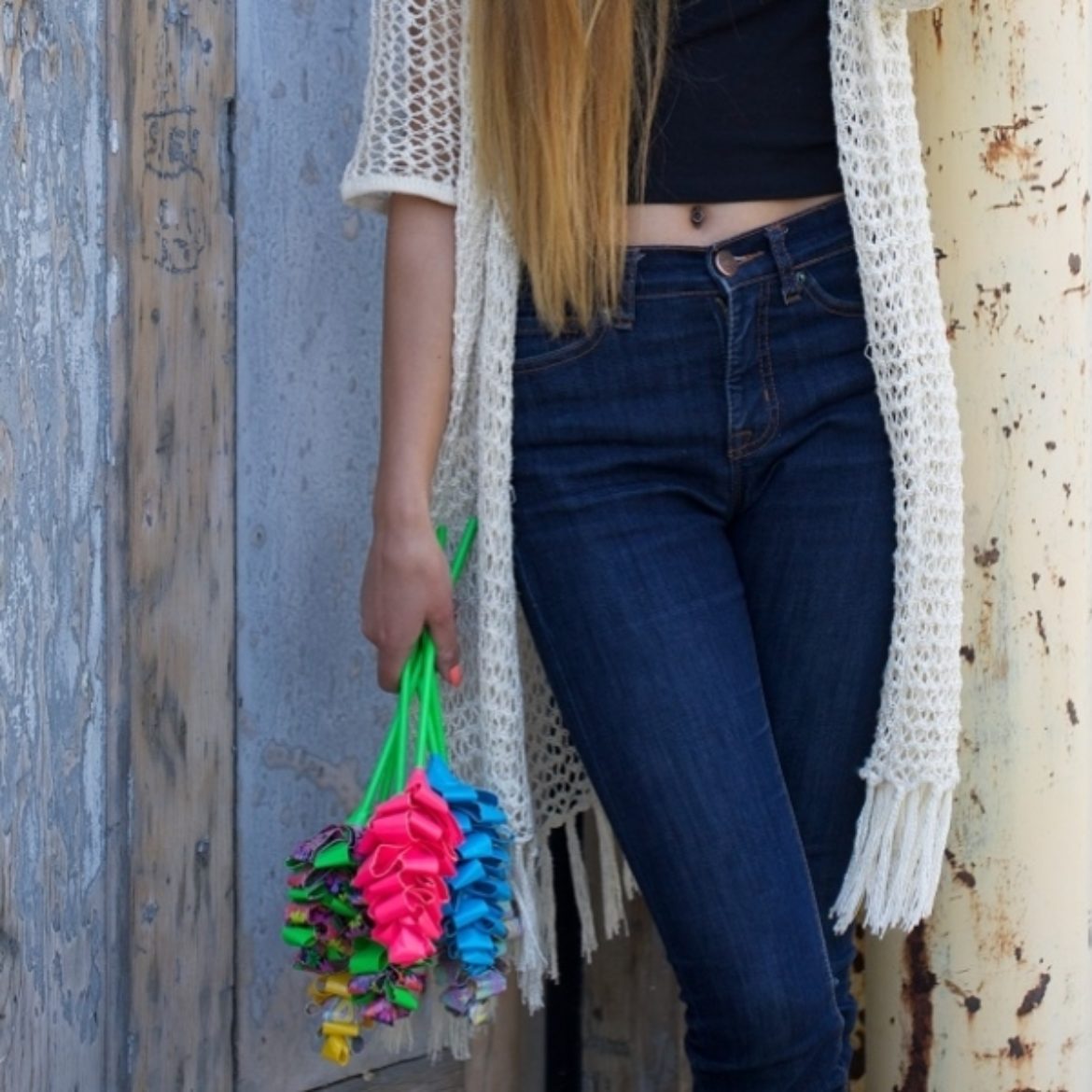 Woman holding a bundle of finished Duck Tape Hyacinth