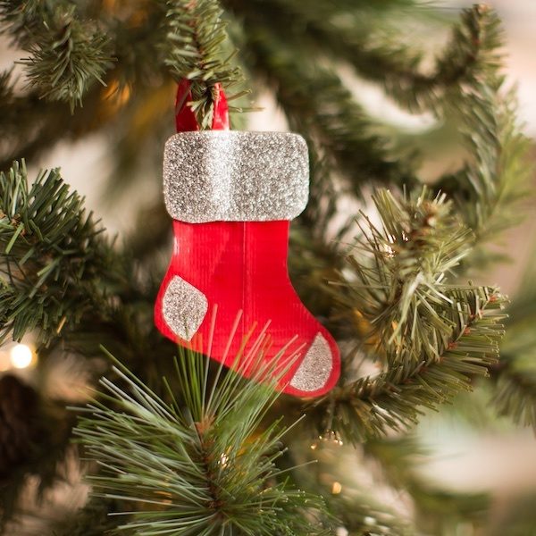 Duck Tape® Mini Stocking Ornaments hanging on a tree