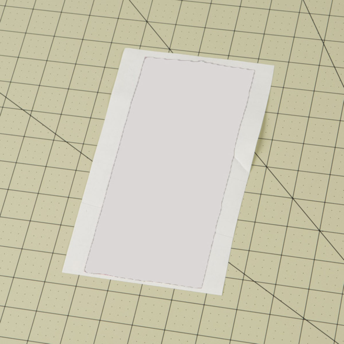 two strips of Duck Tape placed on wax paper to make a fabric