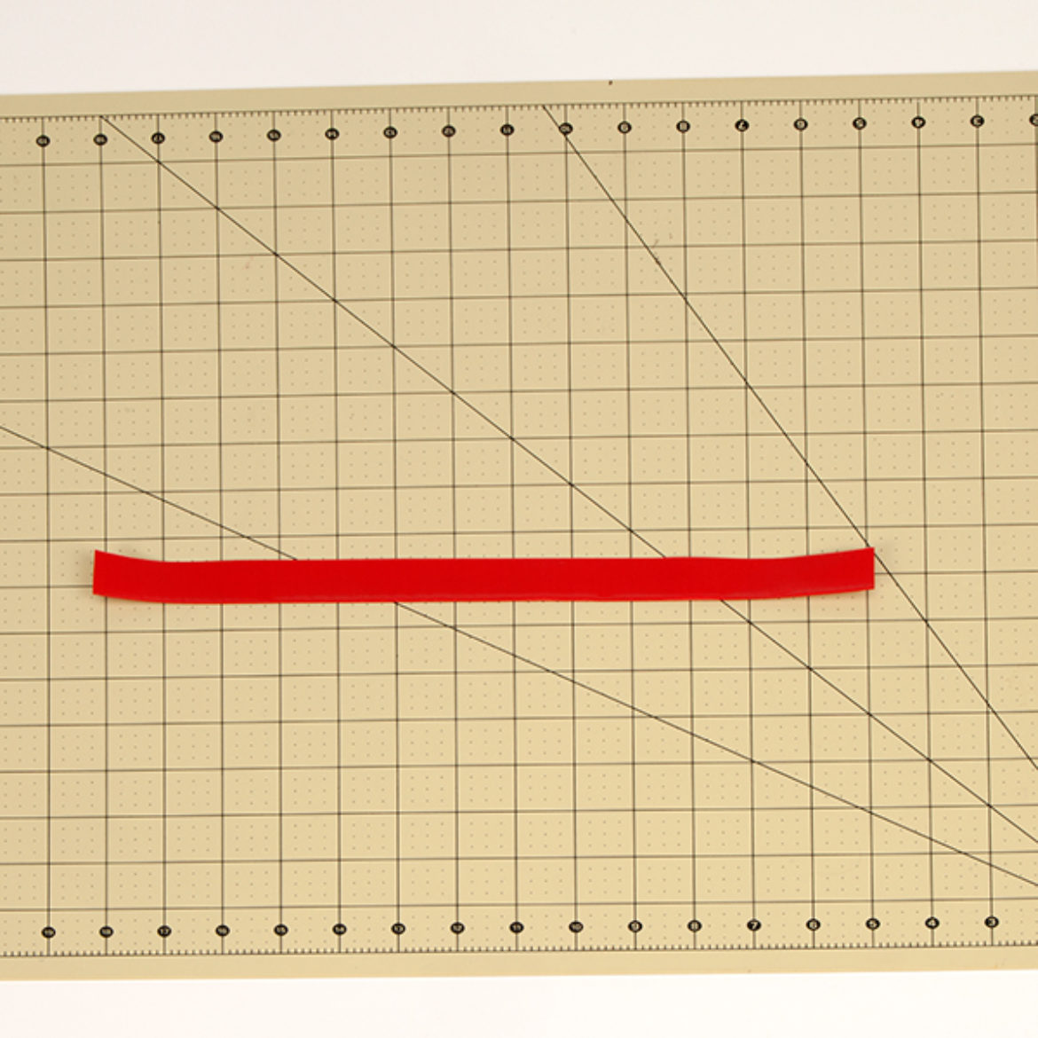 Strip of Duck Tape folded lengthwise to create another double sided strip of Duck Tape