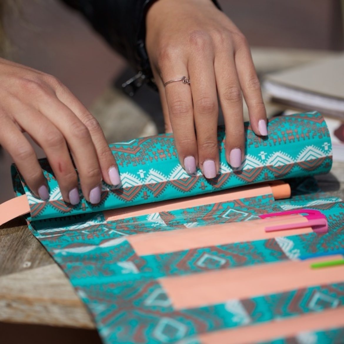 Completed Duck Tape® Roll-Up Pencil Pouch full of pens and pencils