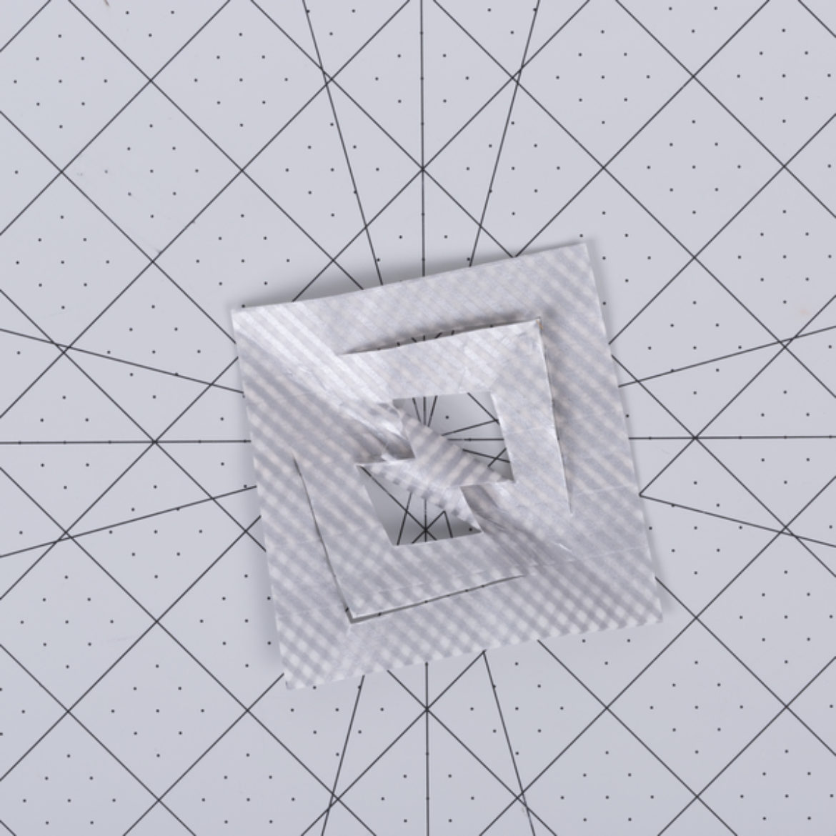 corners of the smaller inner triangles taped together with Crystal Clear Tape