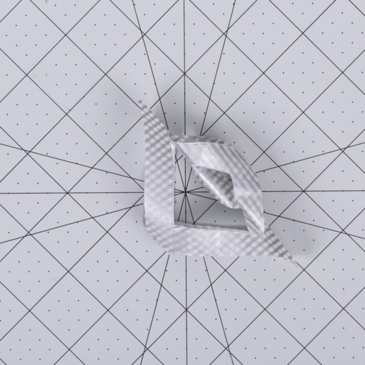 tape the largest, outside triangles' tips together in the opposite direction as the previous step