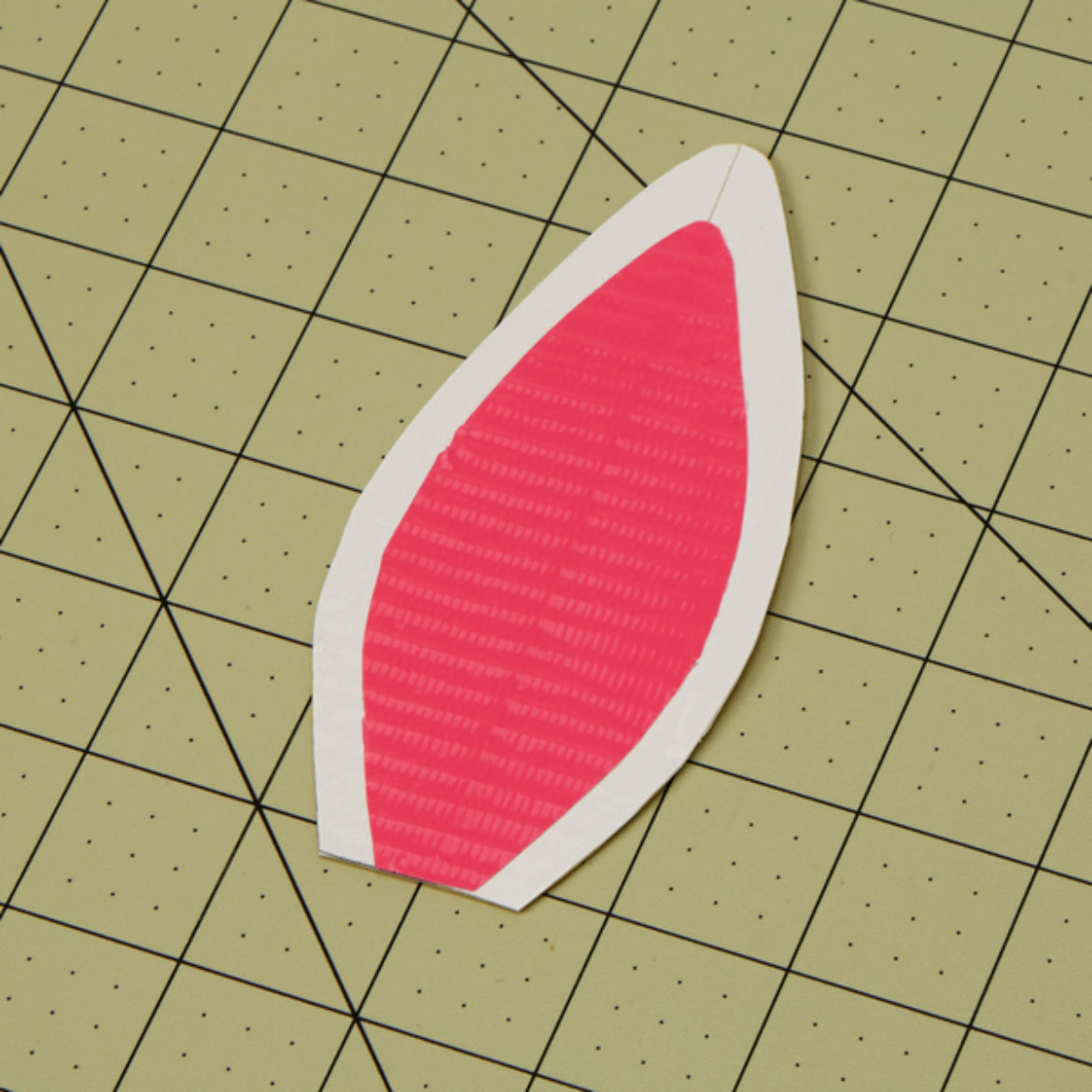 Pink Duck Tape cut to be slightly smaller than the previously made Duck Tape ears. Pink Duck Tape ear shape placed inside the larger white ears