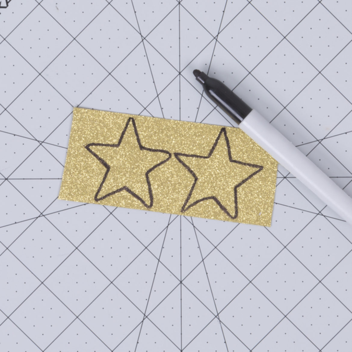 Two stars traced on Duck Glitter fabric