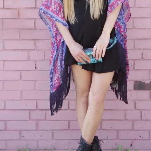 Woman holding a completed Duck Tape Scalloped Wristlet