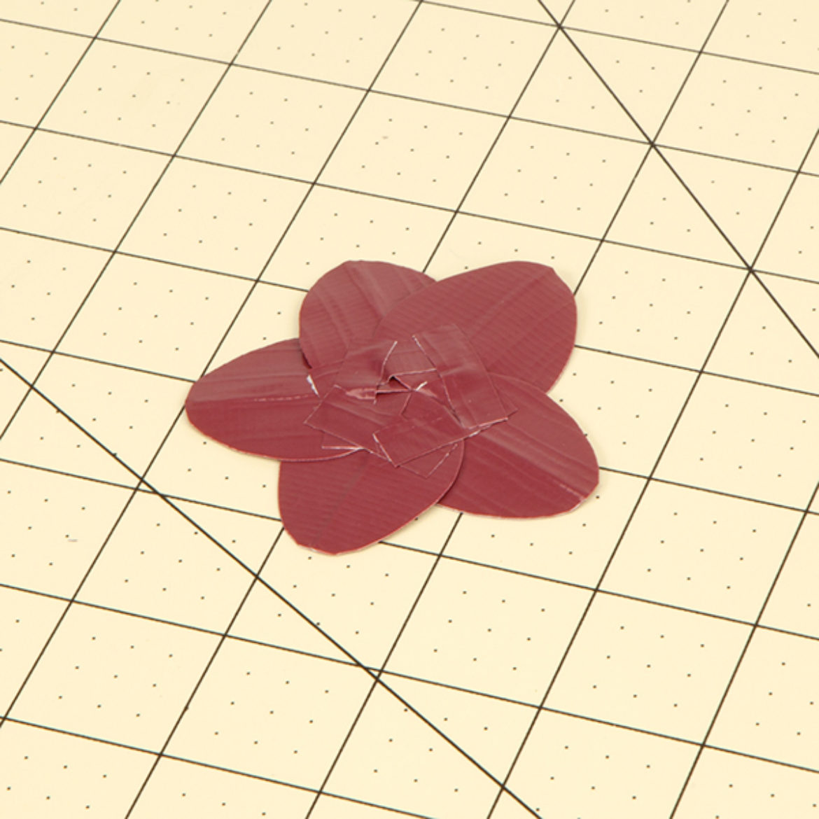 Tape the backs of the petals together to form a flower shape